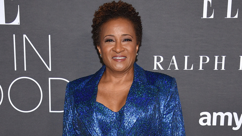 Wanda Sykes on red carpet with blue ensemble