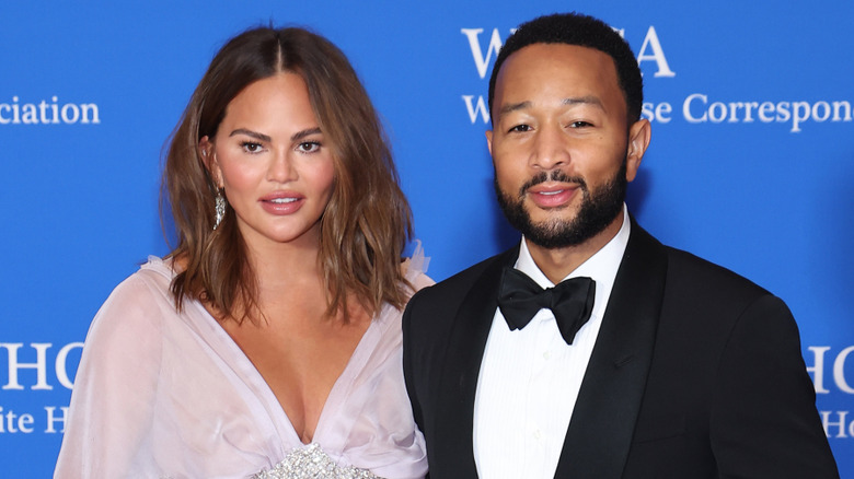 Chrissy Tiegan and John Legend posing