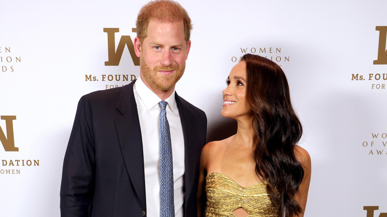 Prince Harry and Meghan Markle posing