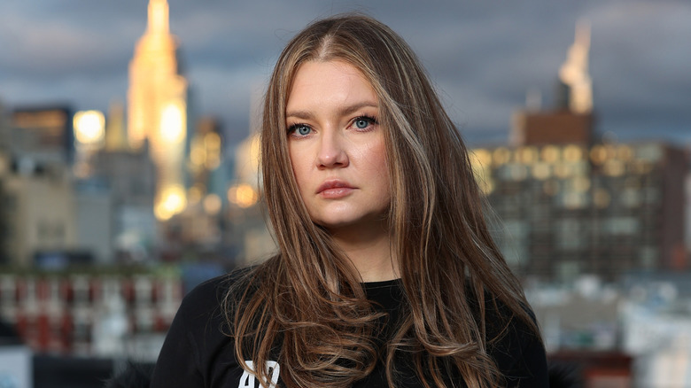 Anna Delvey poses for a photo at her home in 2022