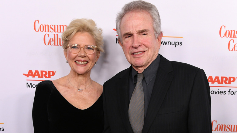 Annette Benning and Warren Beatty hold hands on the red carpet