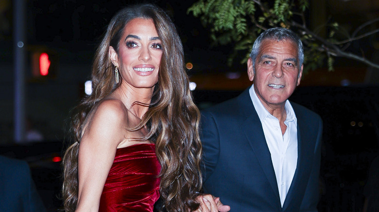 Amal Clooney and George Clooney walking together