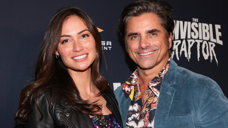 Caitlin McHugh and John Stamos on the red carpet