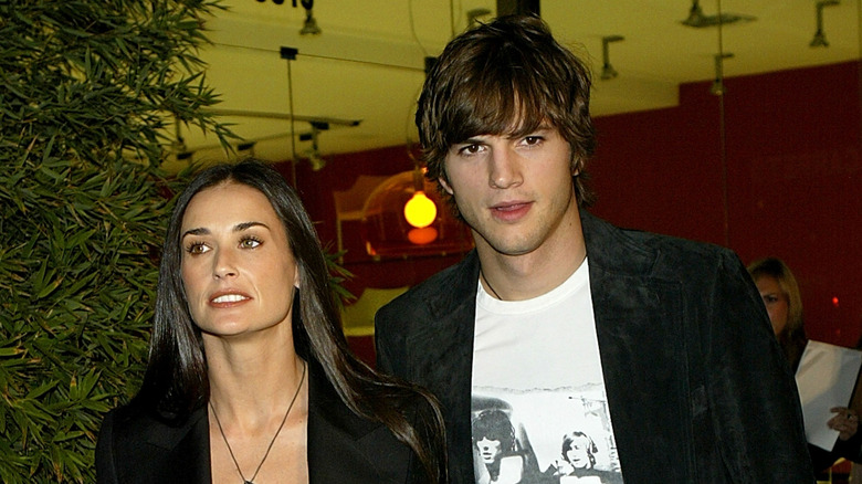 Demi Moore and Ashton Kutcher arrive for the 2003 opening of the Stella McCartney Store