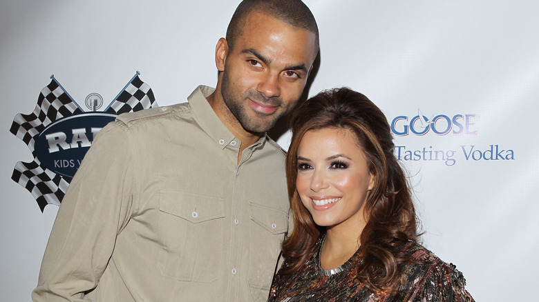 Eva Longoria and Tony Parker smiling on the red carpet in 2010