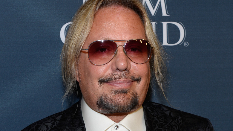 Vince Neil posing in glasses