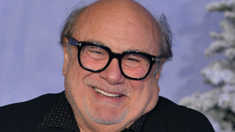 Danny DeVito smiling head tilted
