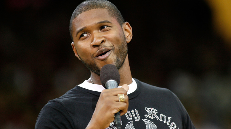 Usher singing at NBA game
