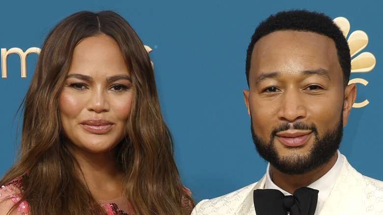 Chrissy Teigen smiling with John Legend