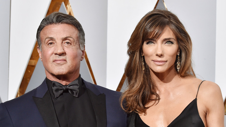 Sylvester Stallone posing with Jennifer Flavin
