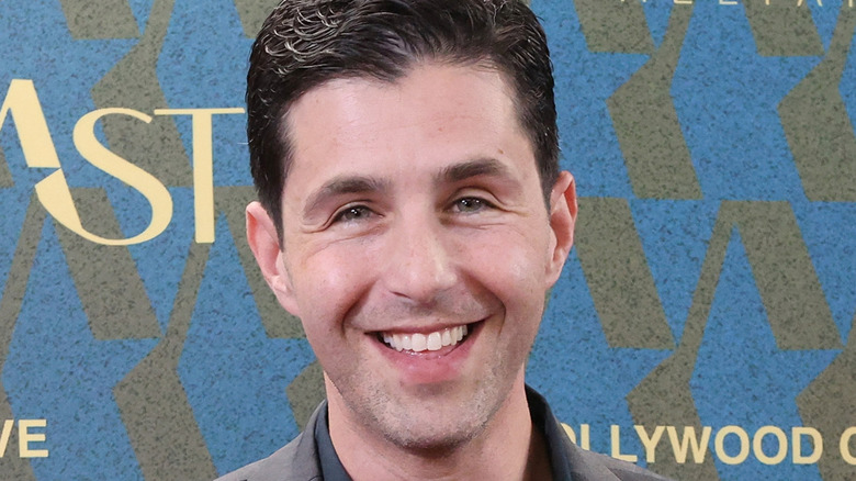 Josh Peck on red carpet wearing suit