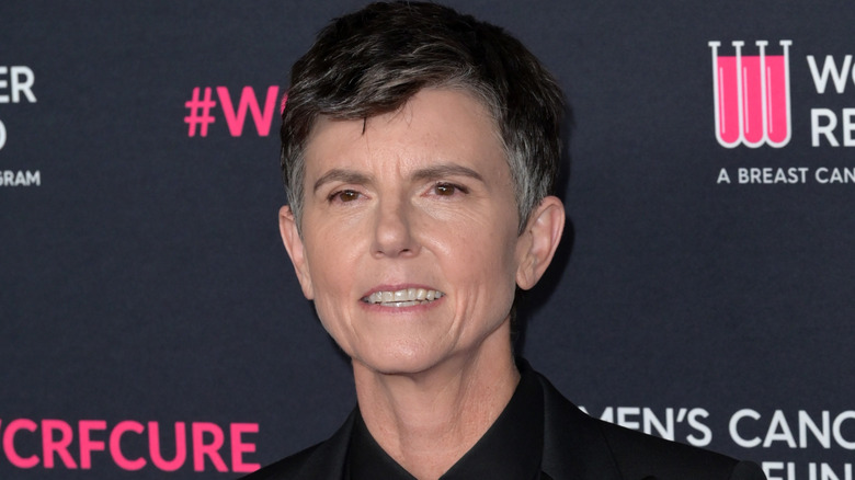 Tig Notaro on red carpet wearing black suit