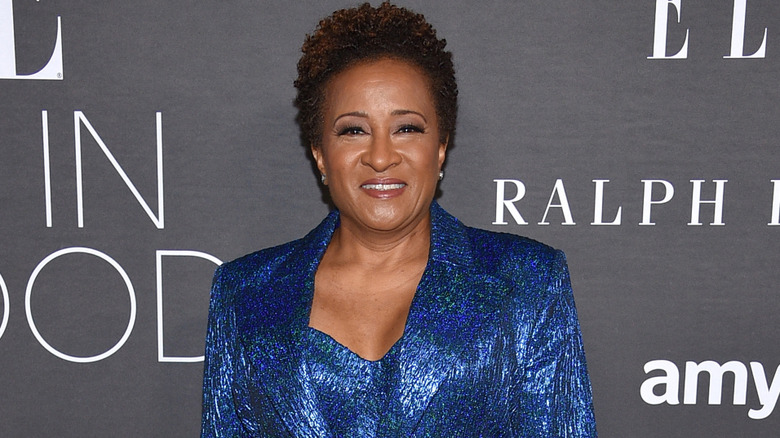 Wanda Sykes on red carpet with blue ensemble