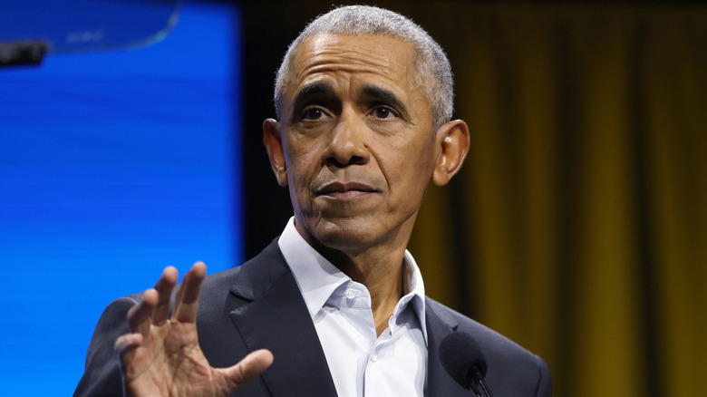 Barack Obama speaking at a podium