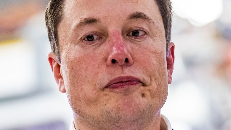 Elon Musk looking down