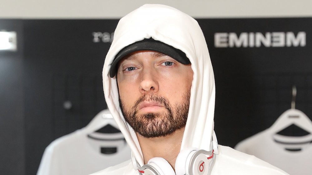 Eminem with white hoodie pulled up