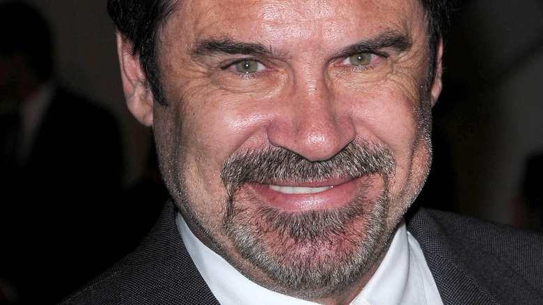 Dennis Miller posing for cameras