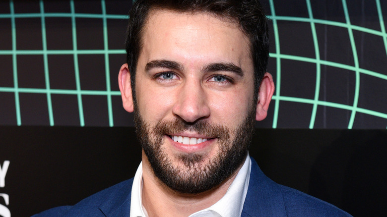 Derek Peth smiling on red carpet