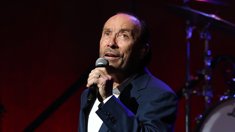 Lee Greenwood singing onstage