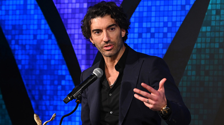 Justin Baldoni speaking on stage