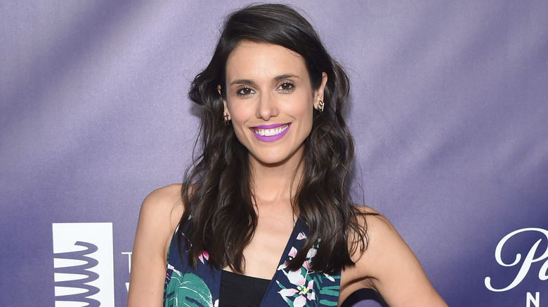 Liz Plank smiles on the red carpet at the Webby awards.