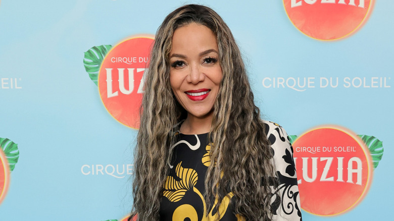 Sunny Hostin posing on the red carpet at a Cirque du Soleil Luzia event
