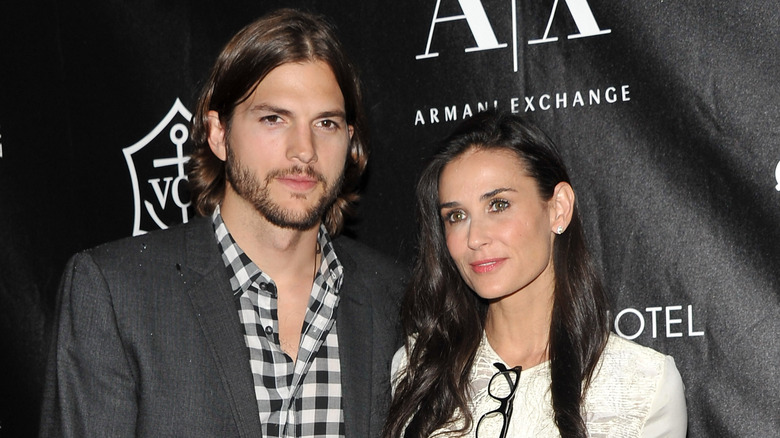 Ashton Kutcher, Demi Moore, posing