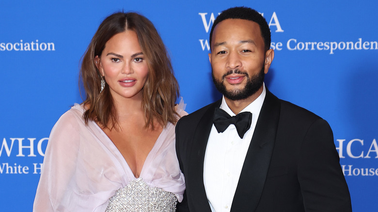 Chrissy Tiegan and John Legend posing