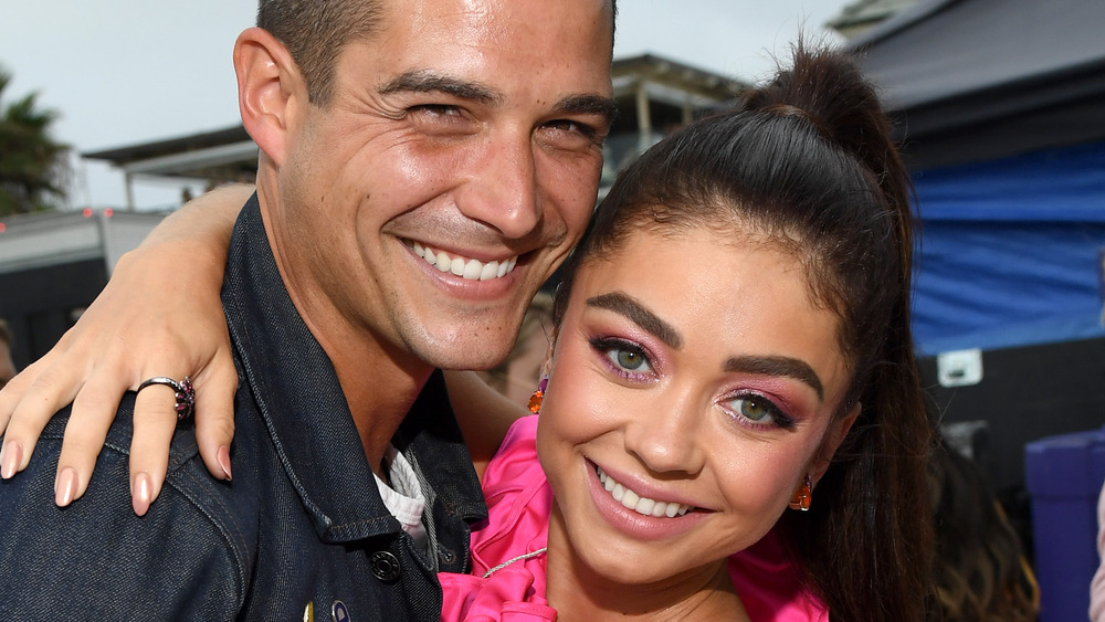 Wells Adams and Sarah Hyland smiling cheek to cheek