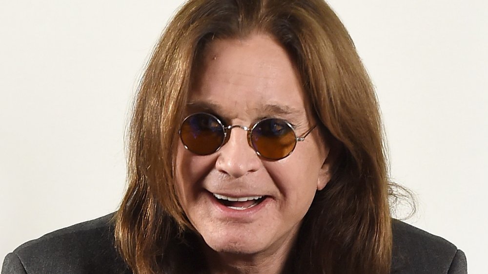 Ozzy Osbourne with dark tinted circle glasses