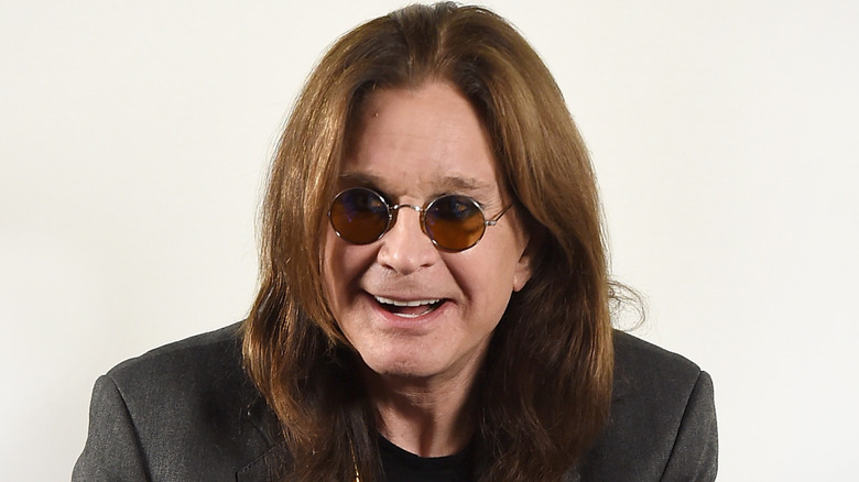 Ozzy Osbourne with dark tinted circle glasses