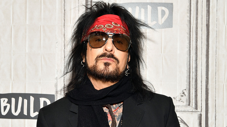 Nikki Sixx with red bandana in hair and black sunglasses