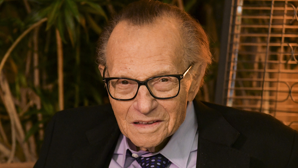 Larry King smiling at camera