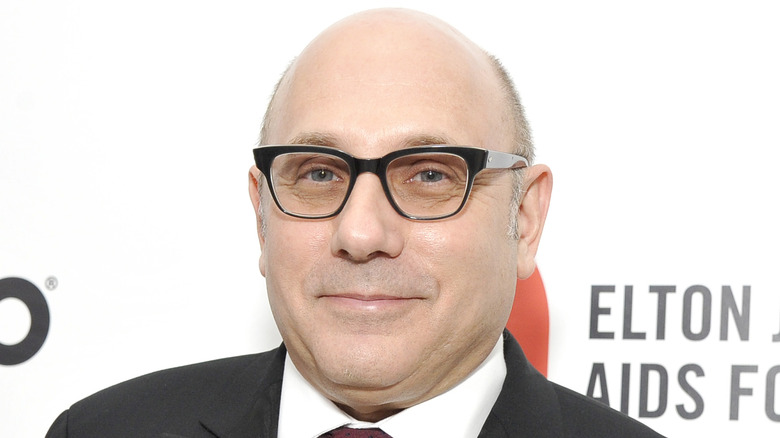 Willie Garson wearing glasses and smiling