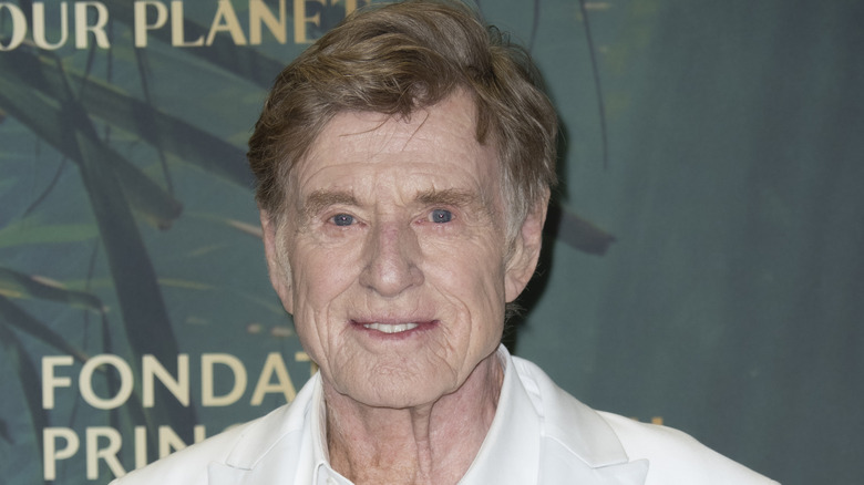 Robert Redford wearing white on the red carpet