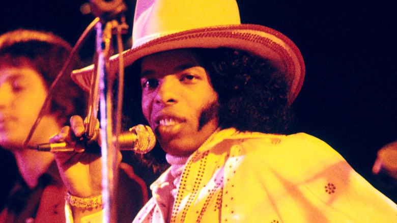 Sly Stone performing on stage.