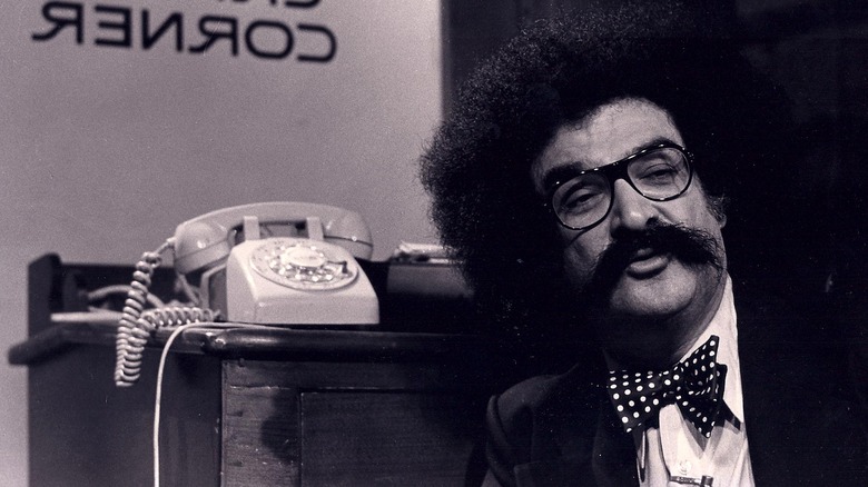 Gene Shalit posing on the set of "Critic's Corner" at "Today" in the 1970s