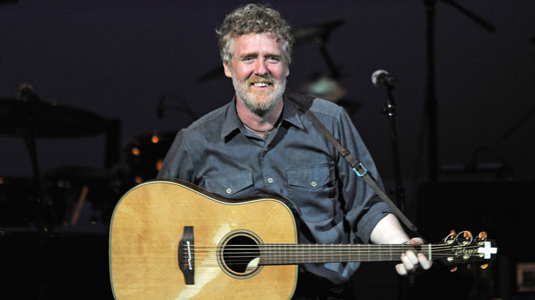 Glen Hansard performing on stage in 2019