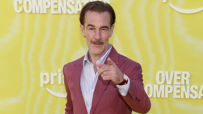 James Van Der Beek posing at the premiere for "Overcompensating" in 2025.