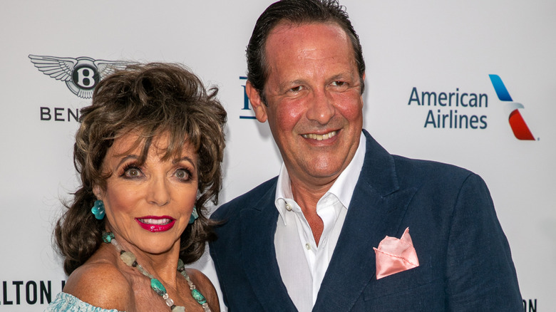 Joan Collins and her husband Percy Gibson on the red carpet