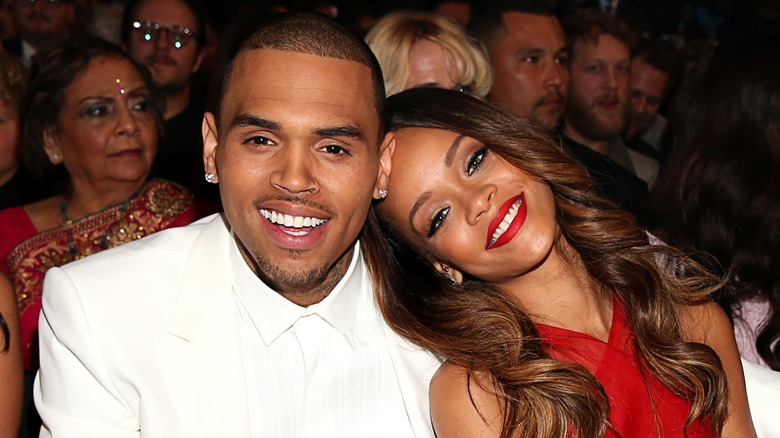 Chris brown and Rihanna smiling