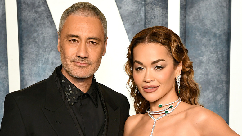 Taika Waititi and Rita Ora posing for a photo