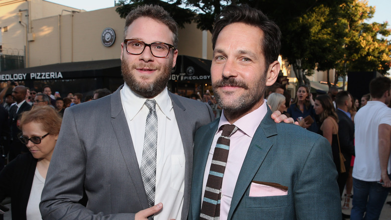 Seth Rogen with hand on Paul Rudd's shoulder