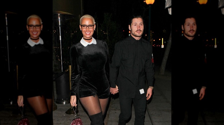 Amber Rose and Valentin Chmerkovskiy smiling and holding hands