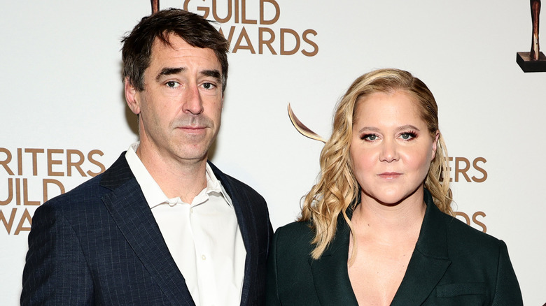 Amy Schumer and Chris Fischer posing