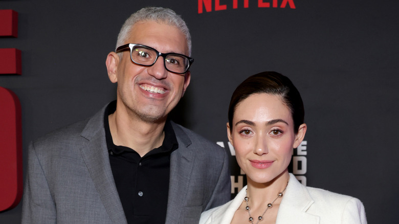 Sam Esmail and Emmy Rossum posing and smiling