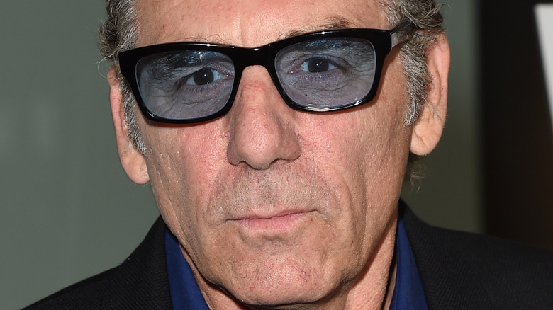 Michael Richards wearing blue tinted glasses
