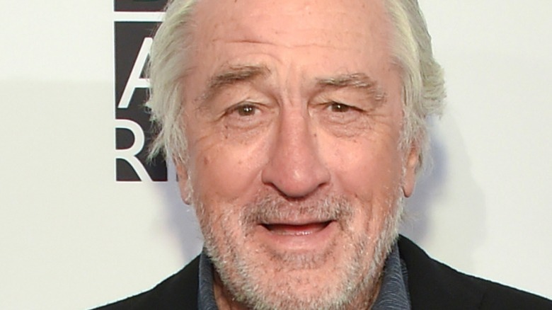 Robert De Niro posing for photos