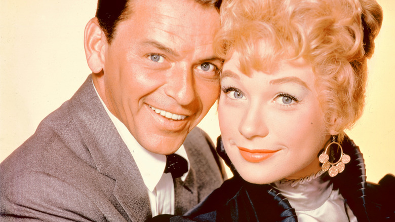 Frank Sinatra, Shirley MacLaine with heads pressed together in 1960 portrait