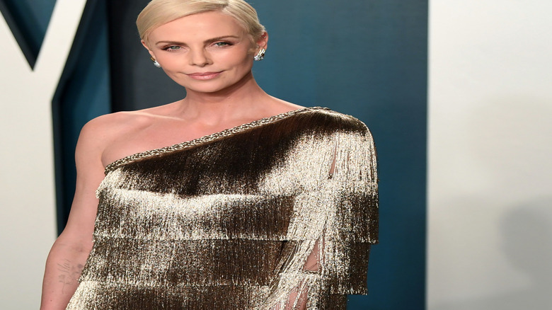 Charlize Theron smirking